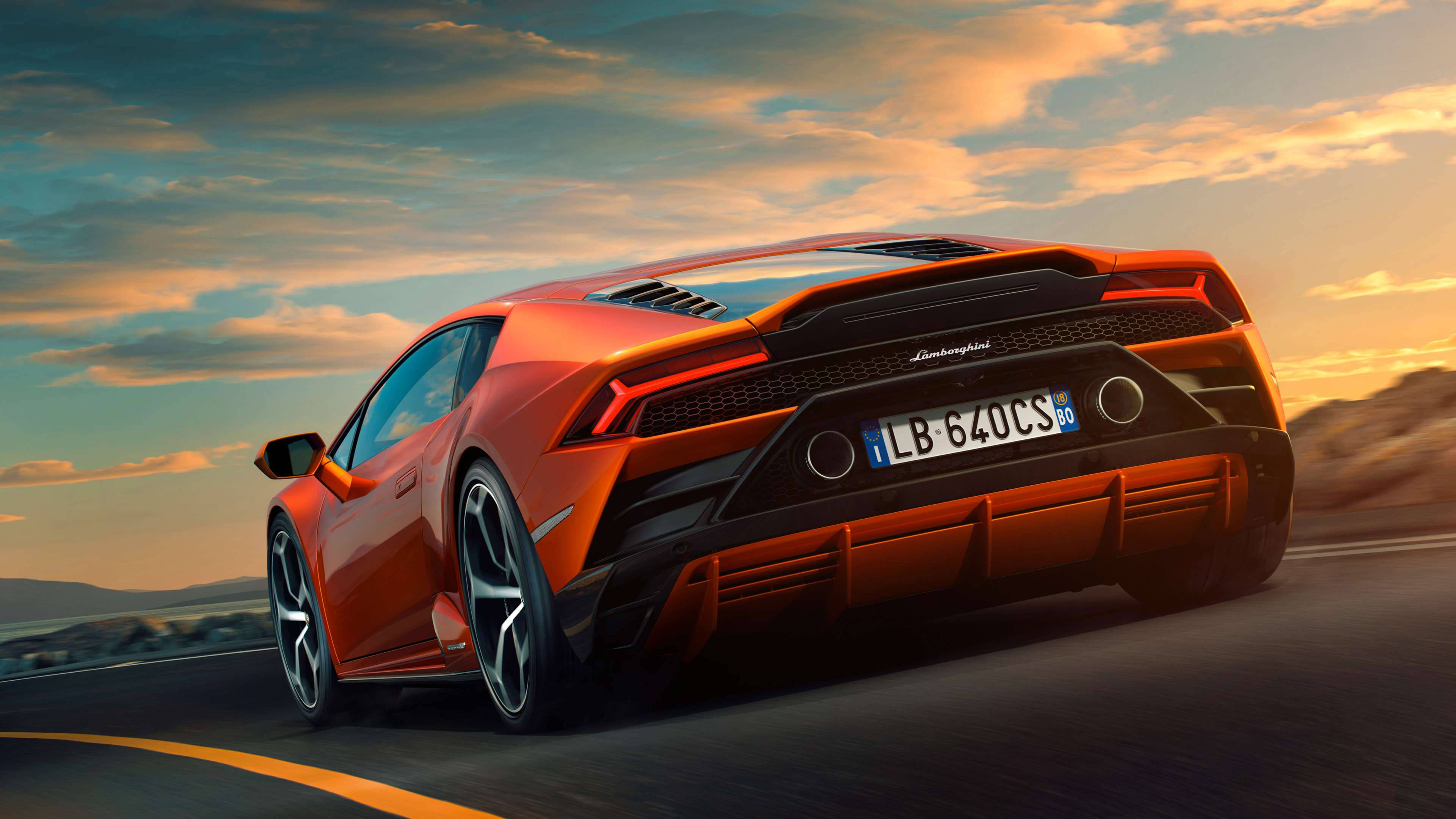 سيارة لامبورغيني برتقالية معدنية 4K خلفية