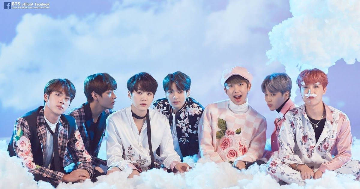 صورة جماعية لفرقة BTS مع السحب خلفية