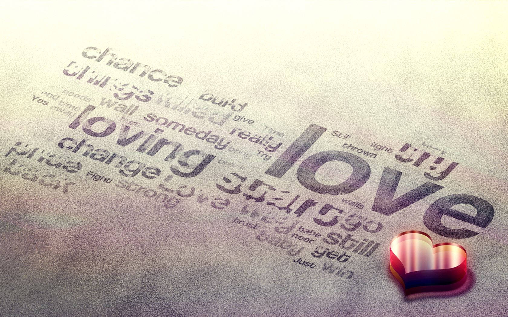 كلمات حب مختلفة مثل 'loving' مكتوبة على سطح رمادي مع قلب ثلاثي الأبعاد أحمر لامع على الجانب.