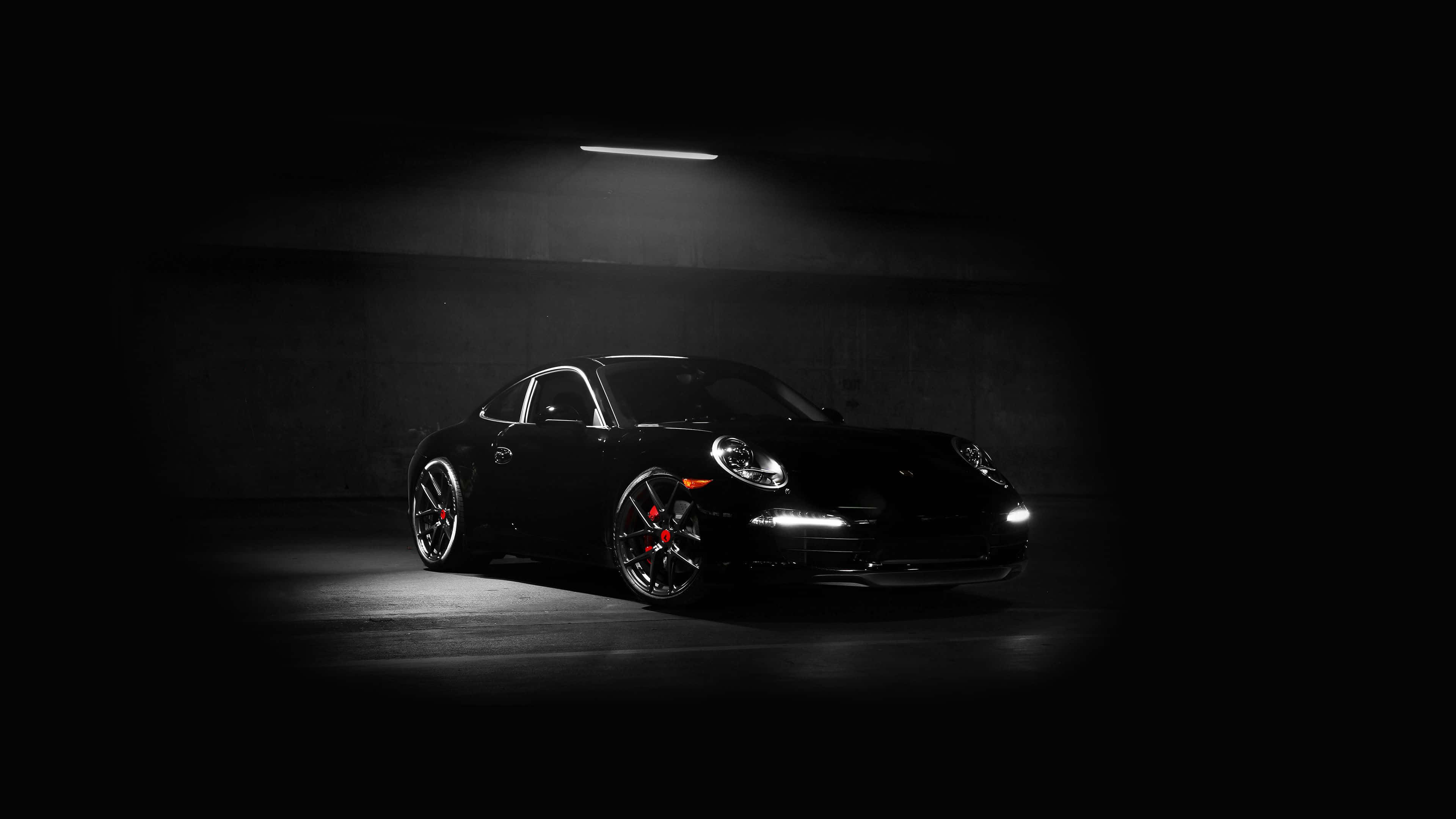 سيارة سوداء بورش 911 بدقة 4K خلفية