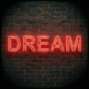 لافتة نيون حمراء ملهمة تحمل كلمة DREAM على جدار من الطوب. — نيون أحمر خلفية